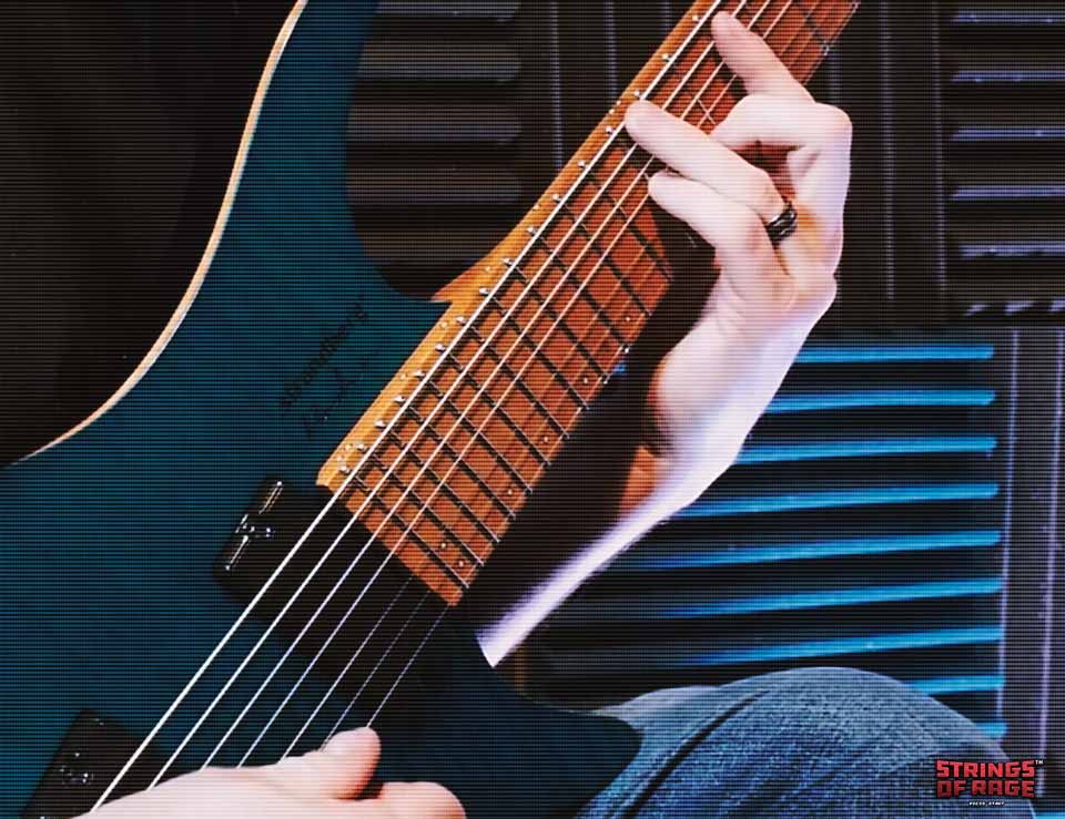 Intervals for Guitar Closeup of Guitar Player Holding a Blue Strandberg 7 String Guitar Playing Chords